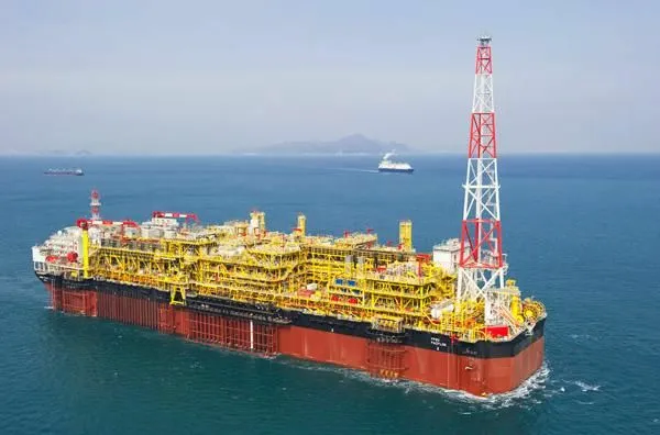 An offshore oil platform at sea.